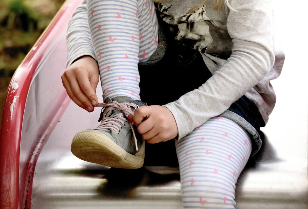 child-tying-shoelaces